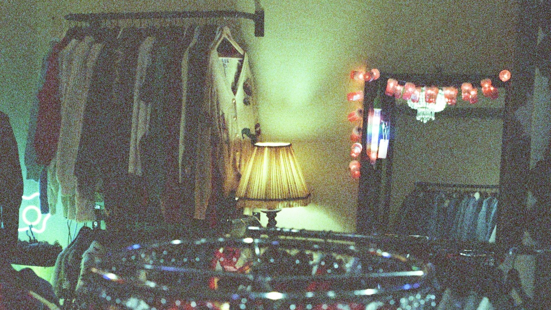 assorted clothes hanged on rack