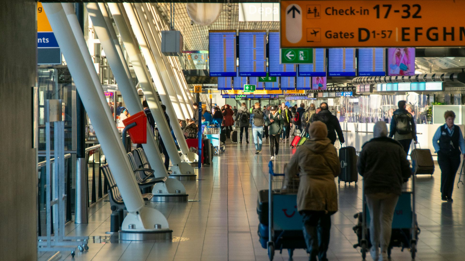 a group of people walking through an airport