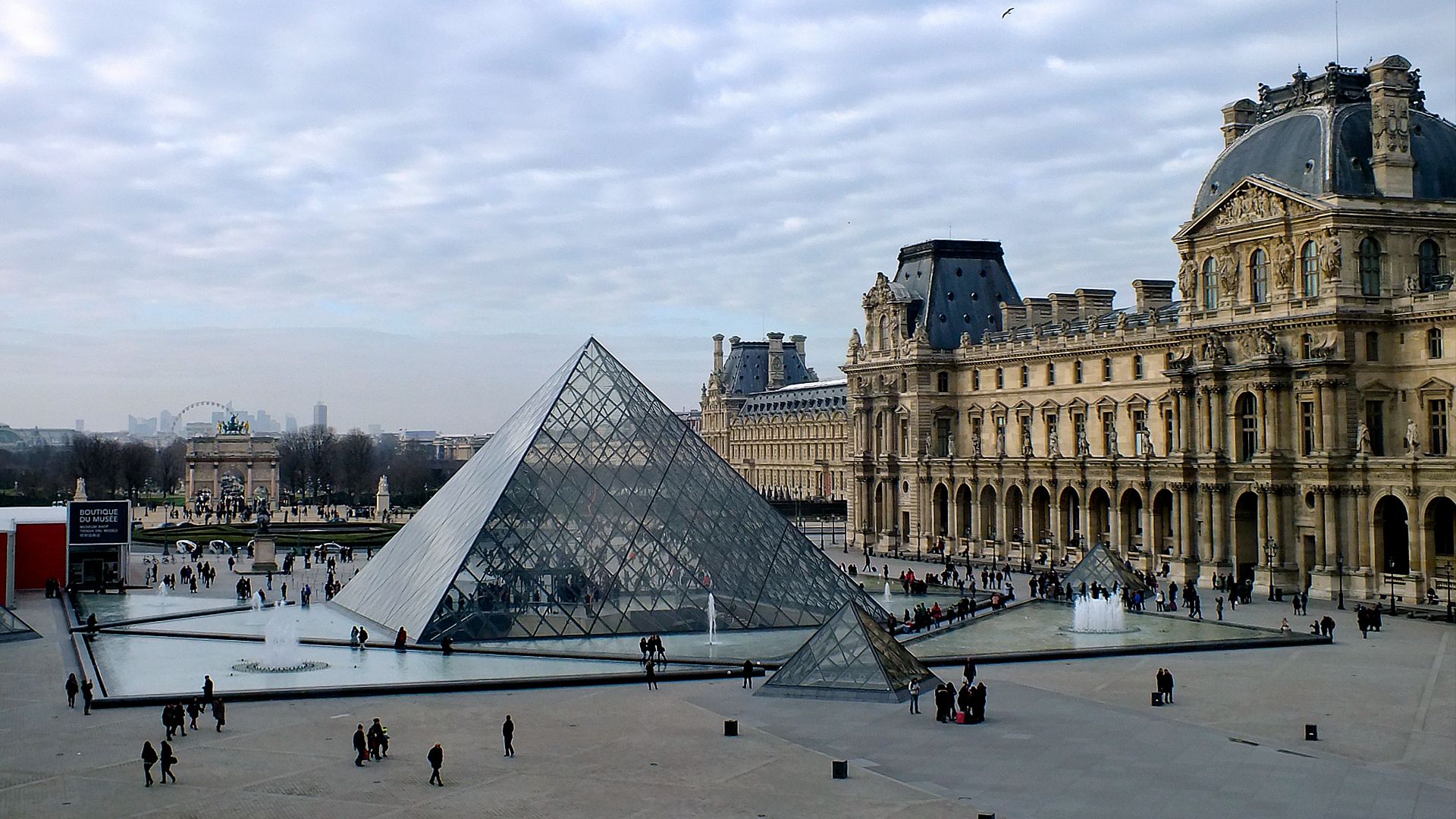 glass structure beside brown building