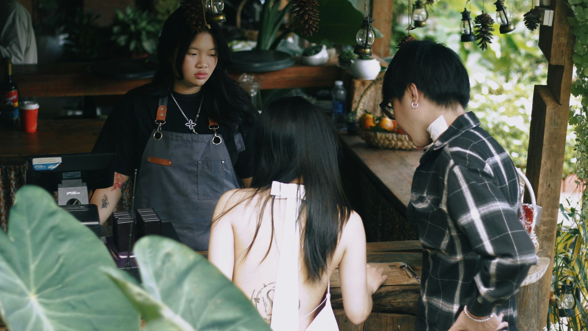 a group of people standing around a bar