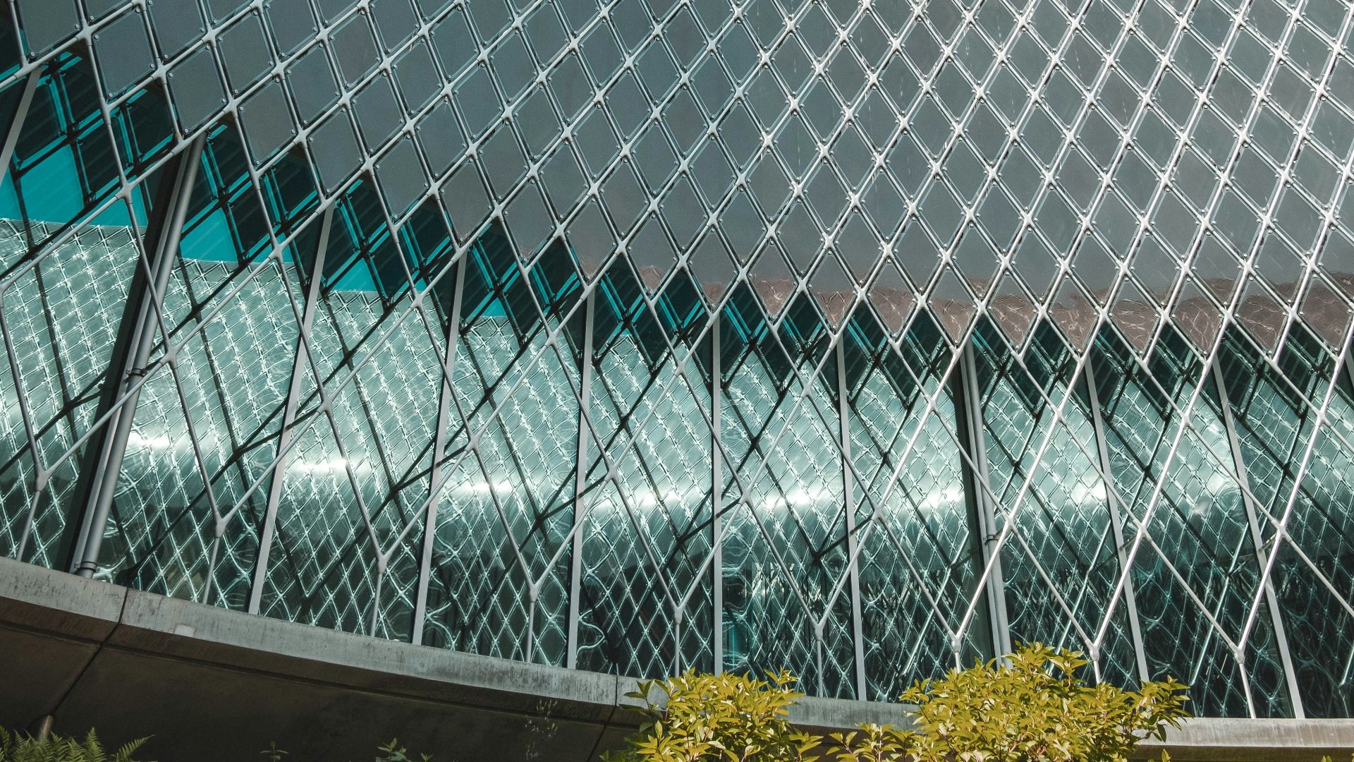 a large building with a triangular design on it's side