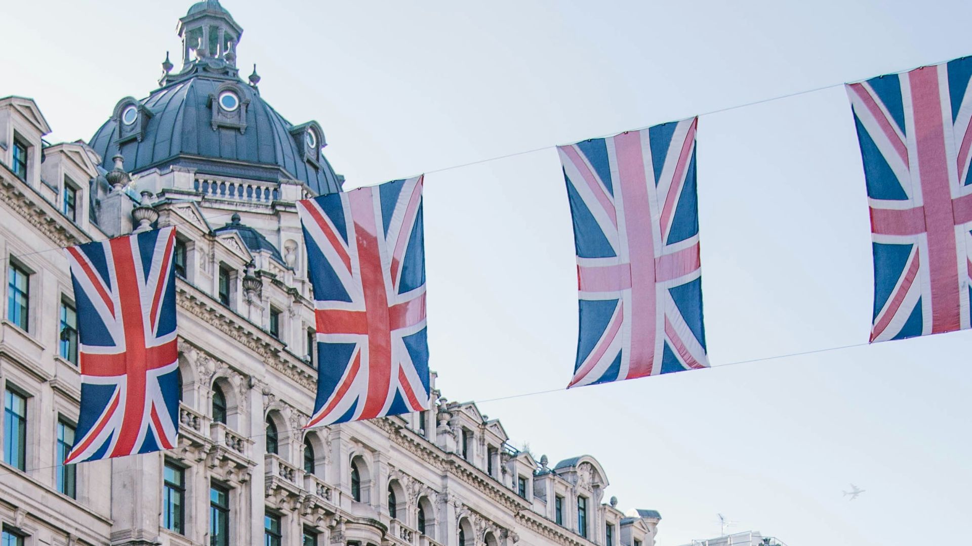 photo of car and bus near castle