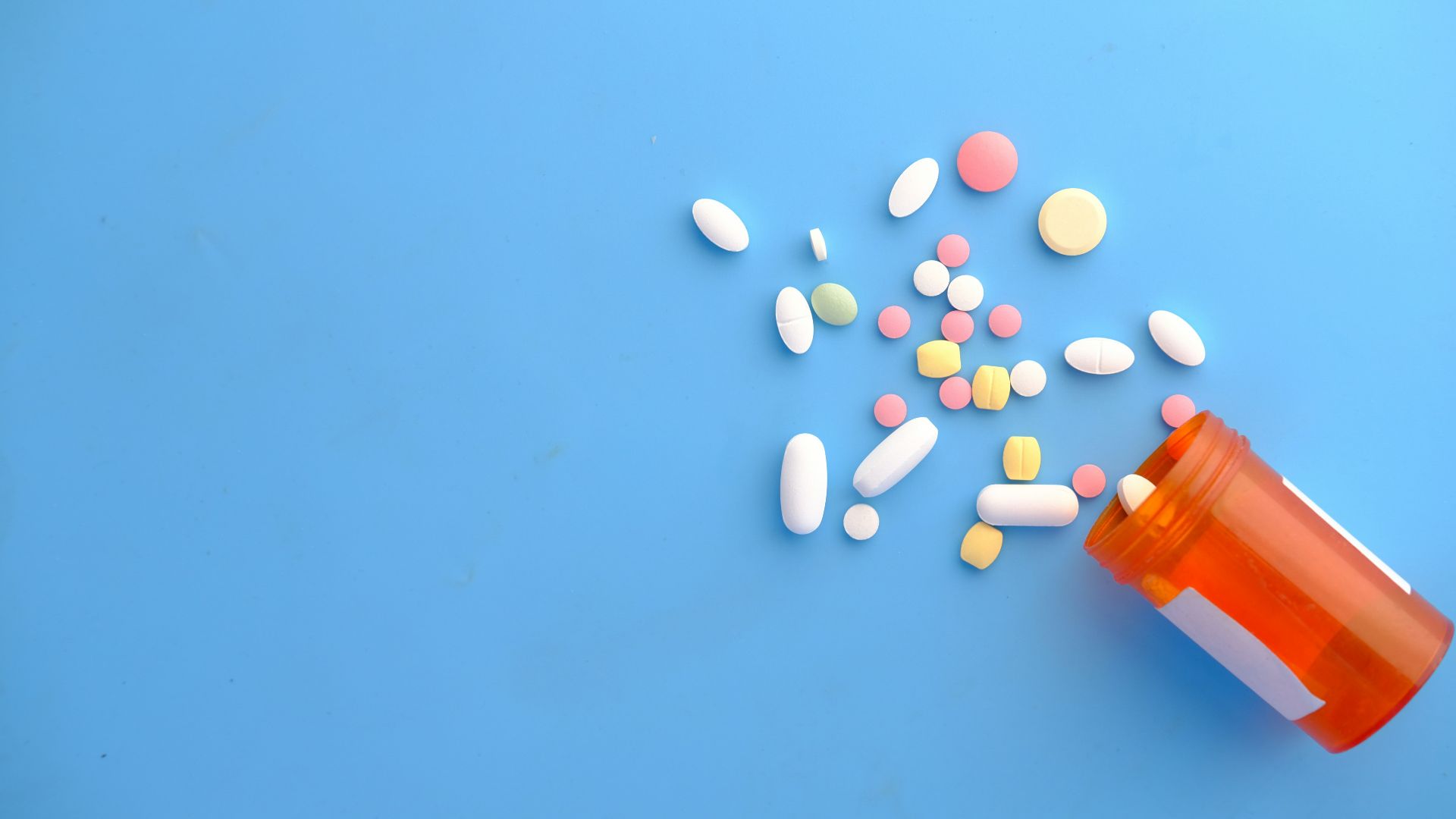 orange and white medication pill