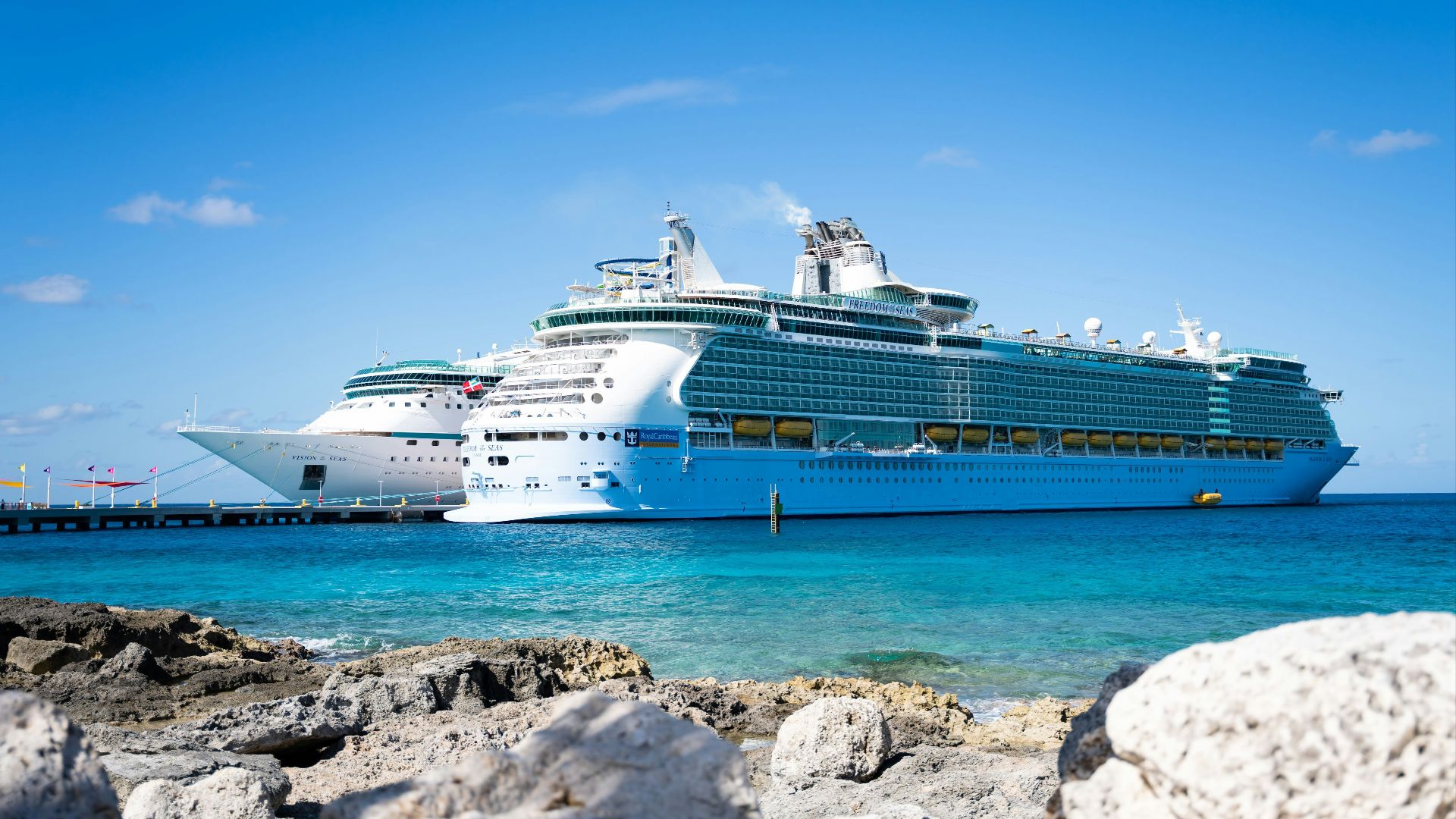 a cruise ship docked at a dock in the ocean