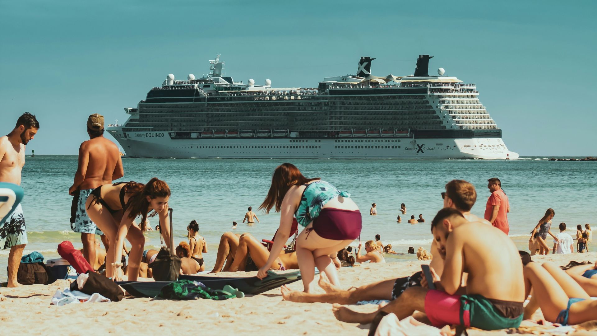 people sitting on beach chairs during daytime