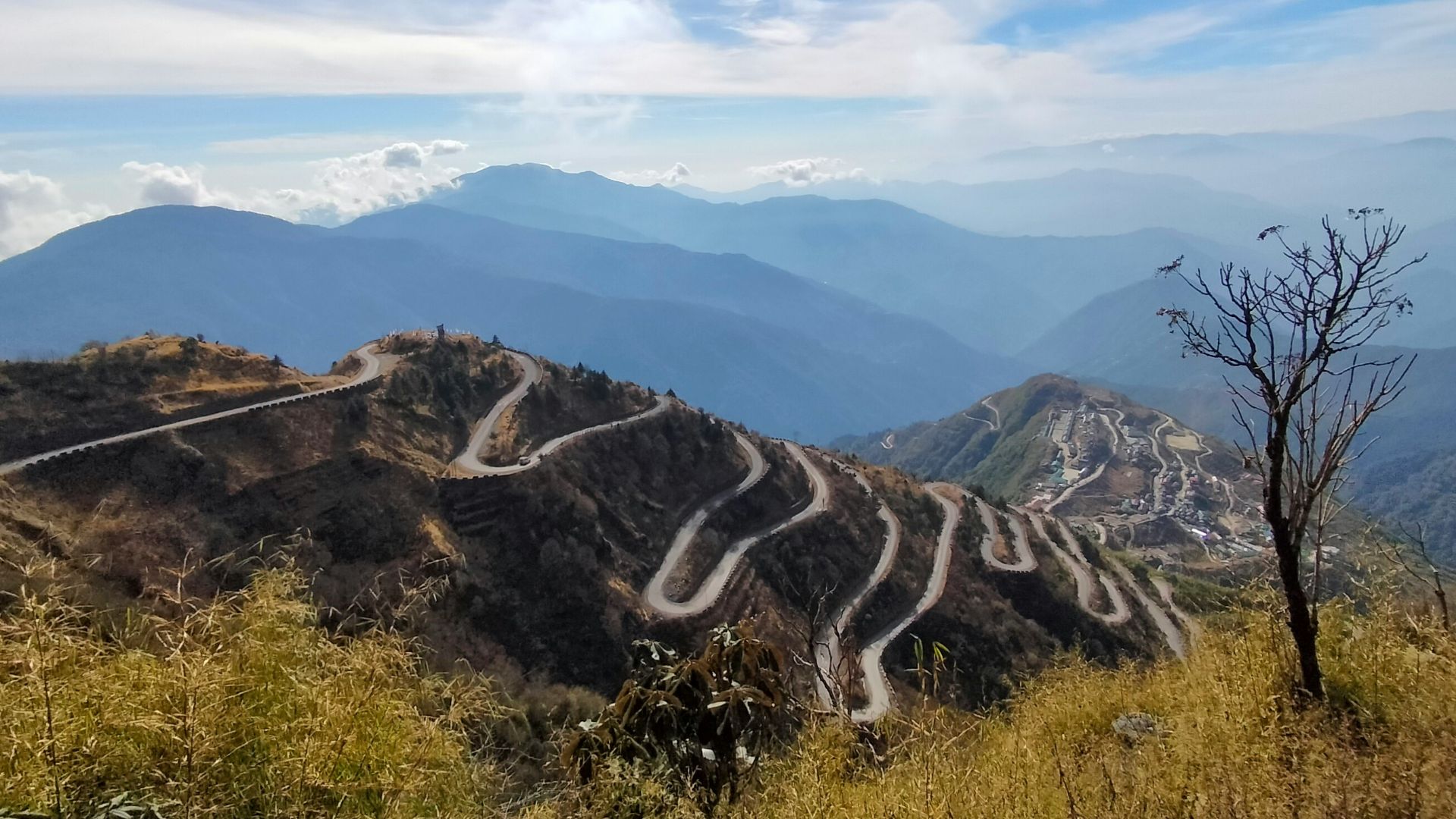 A view of a winding road in the mountains