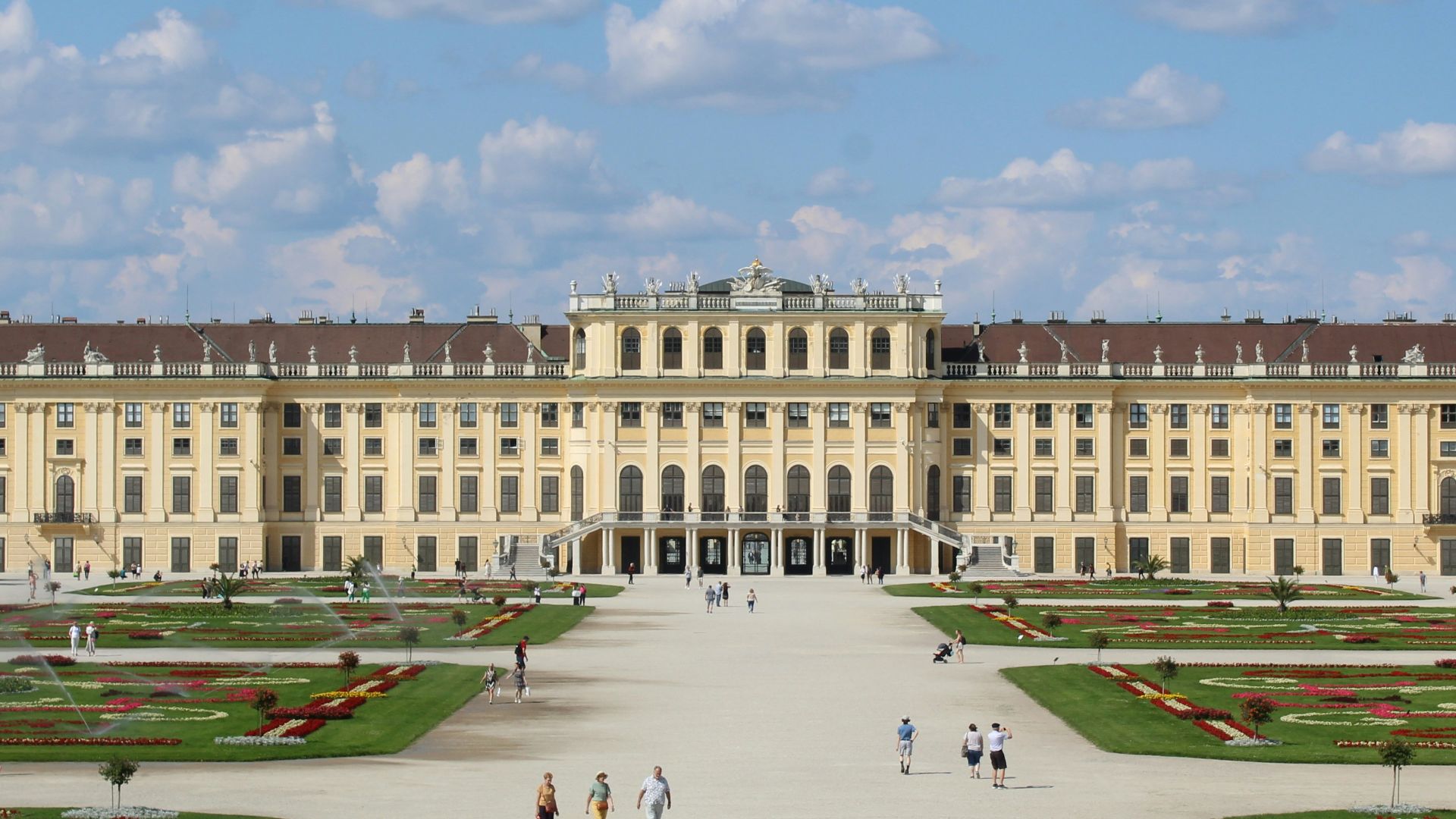 A large building with a lot of people in front of it