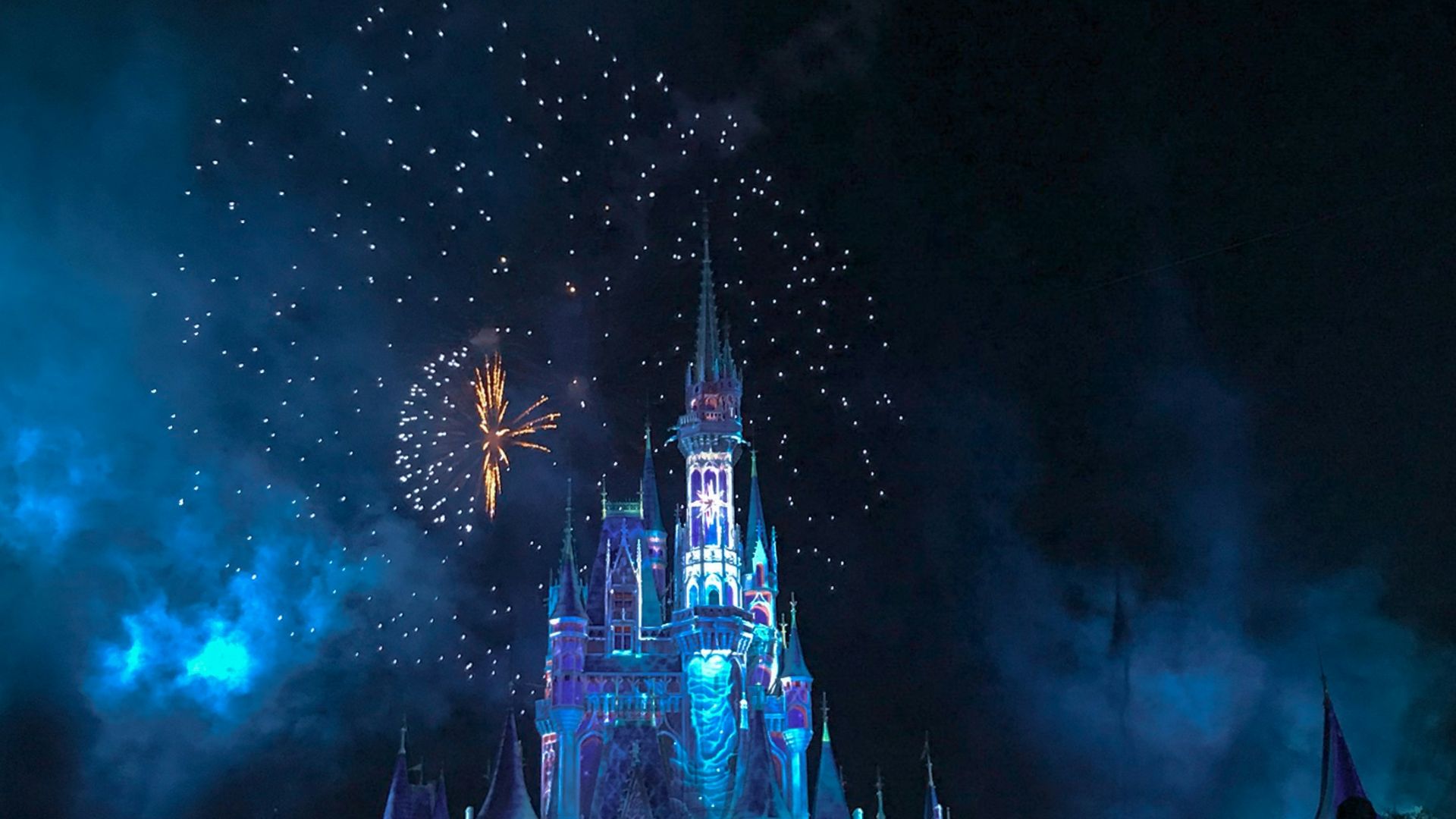 crystal castle with fireworks at night