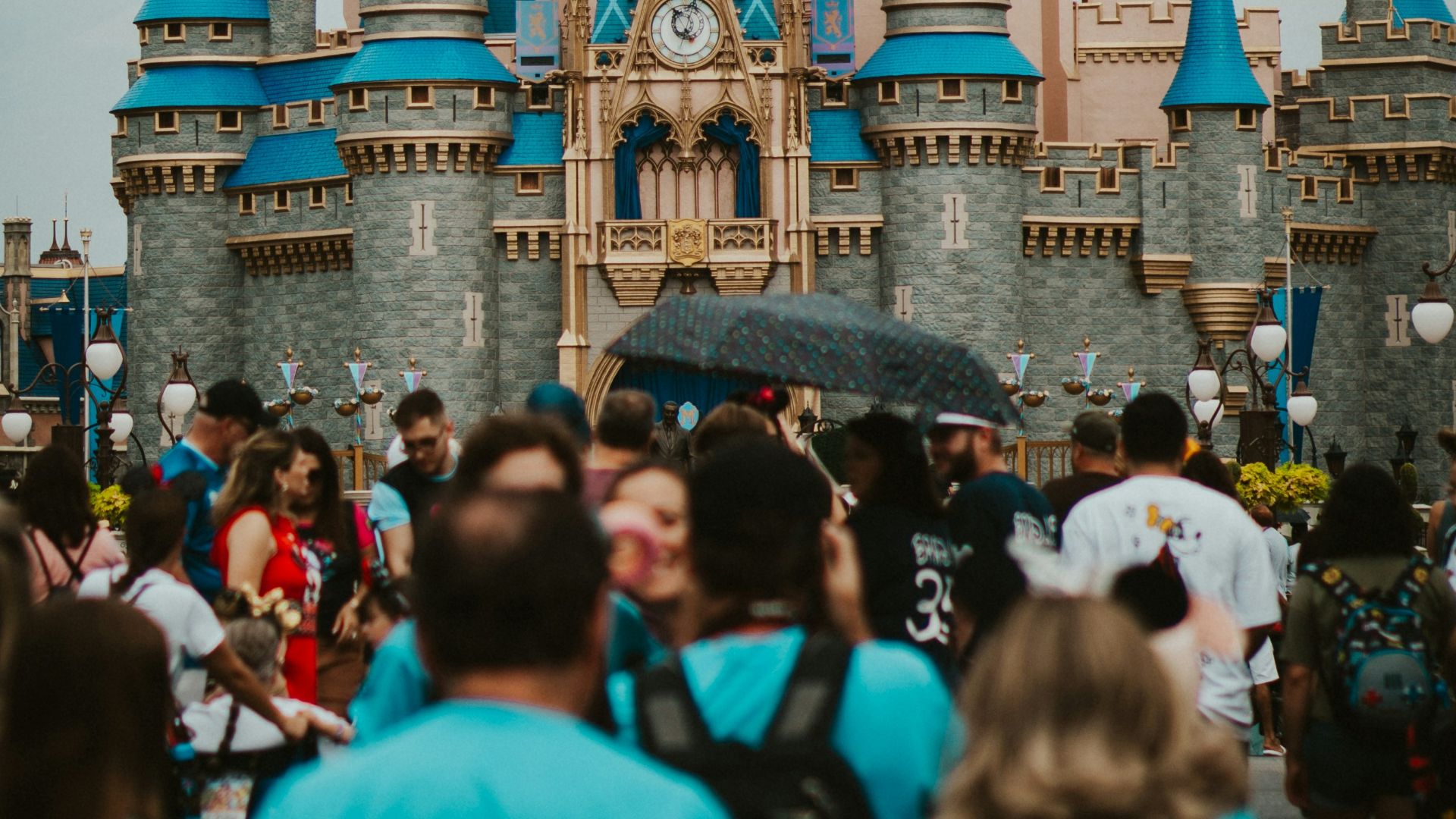 a group of people standing in front of a castle