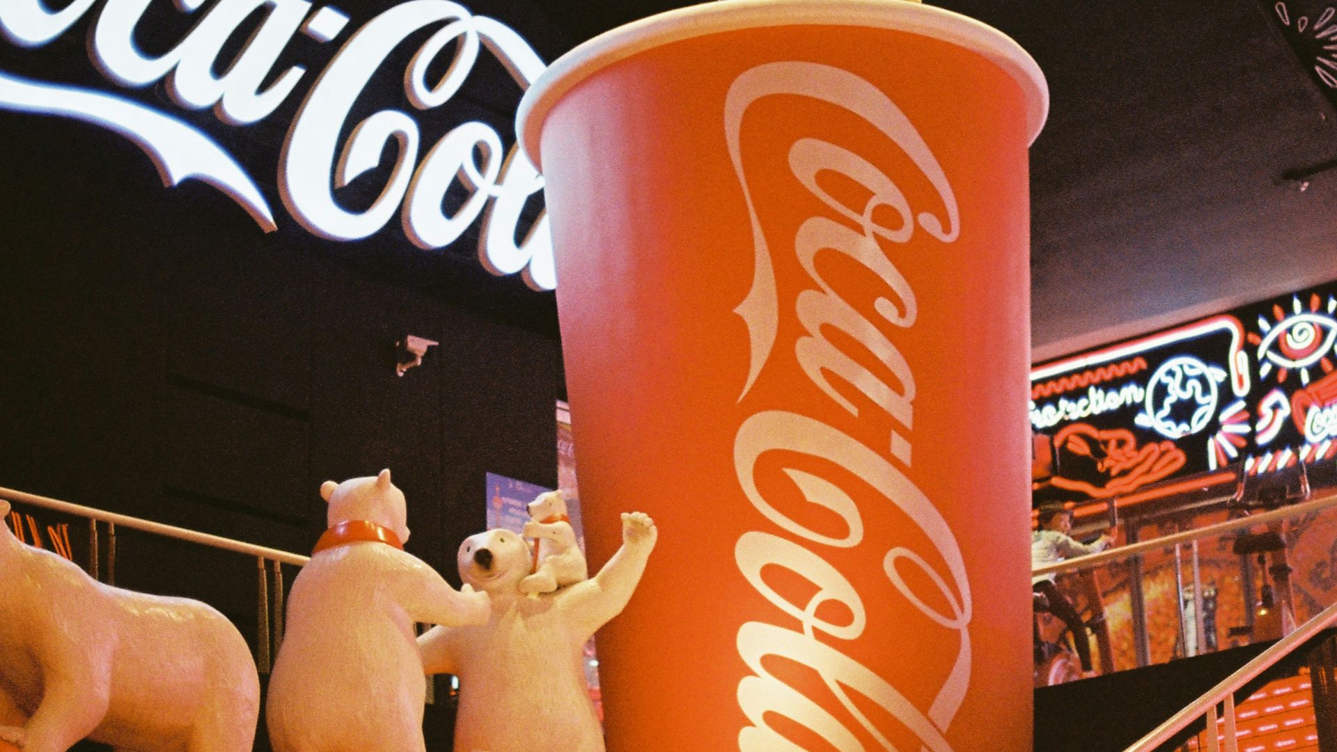 coca cola can on white metal rack