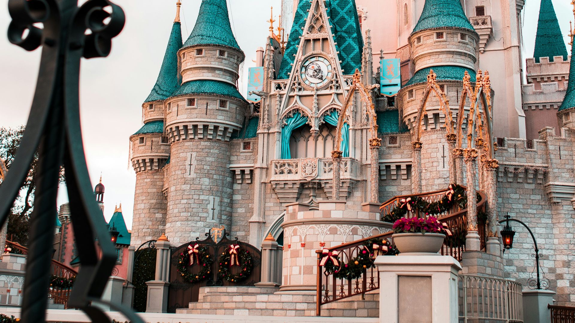 white and blue castle under cloudy sky during daytime