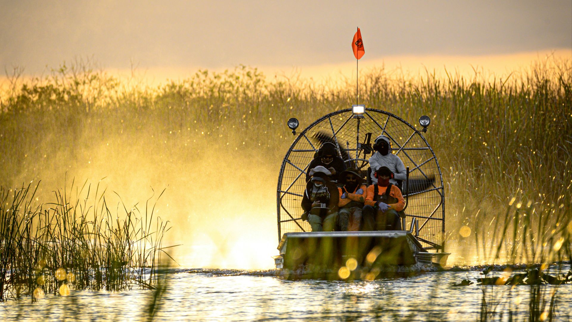 a couple of people on a boat in a body of water