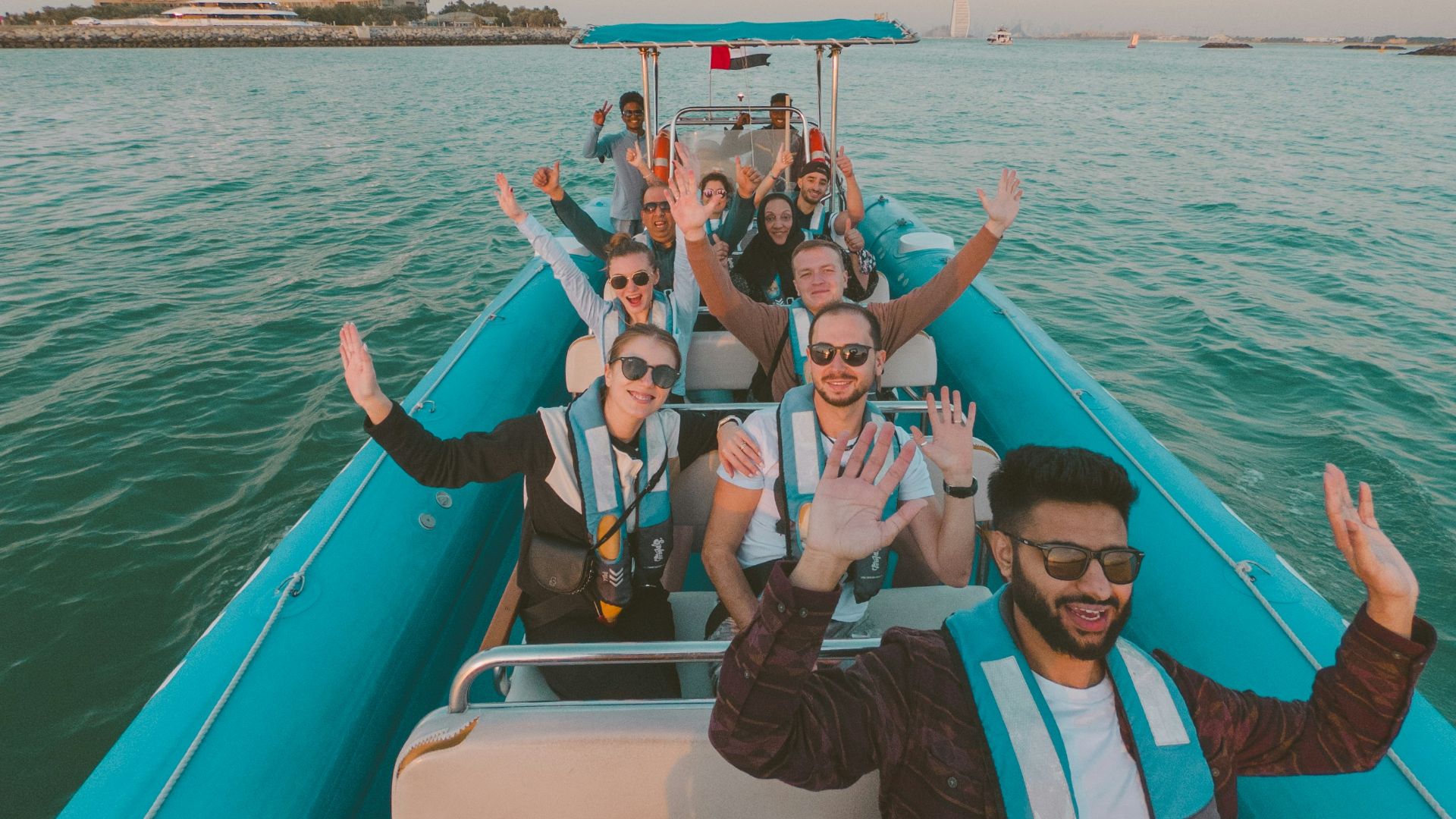 a group of people riding on the back of a boat