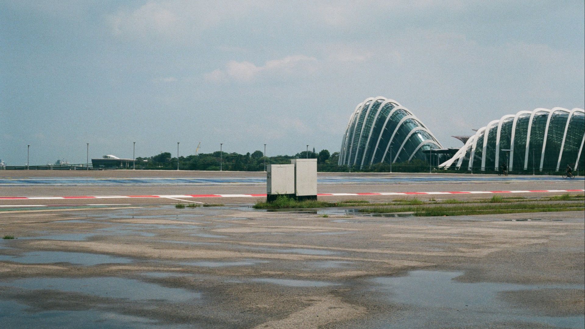 a large building sitting on top of an airport tarmac