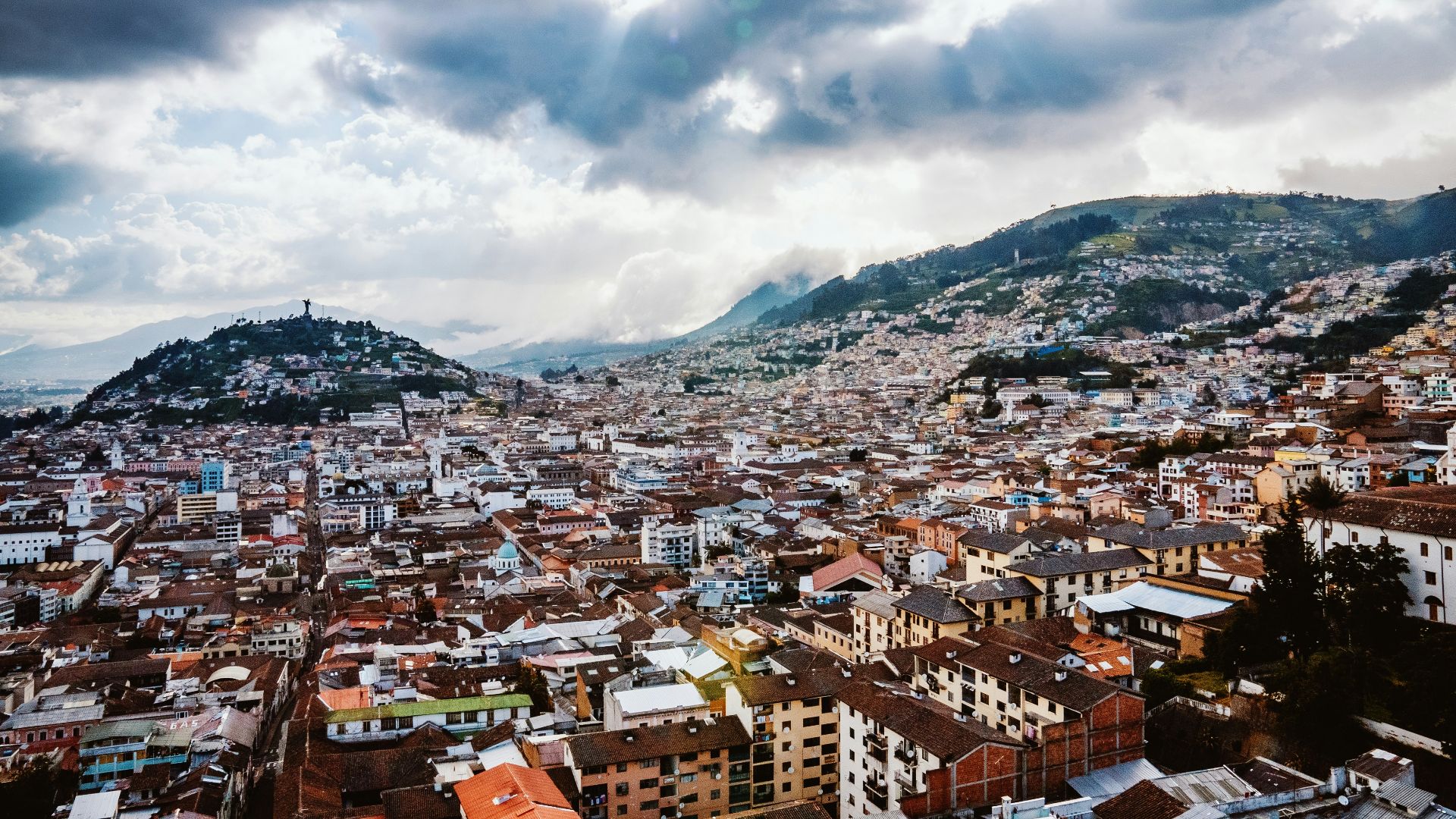 a view of a city with mountains in the background