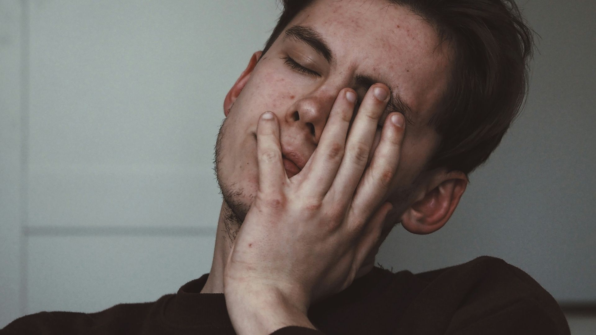 man wearing black crew-neck top
