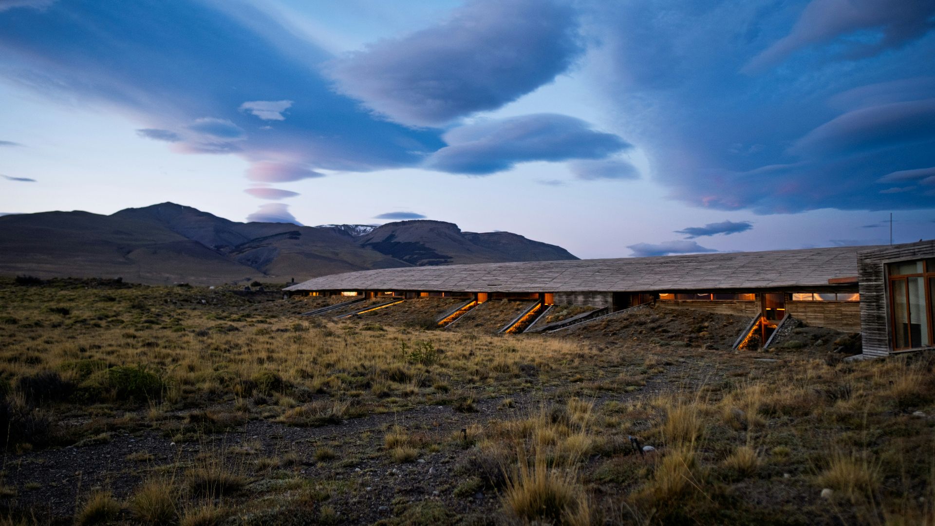 A modern building with a mountain landscape.