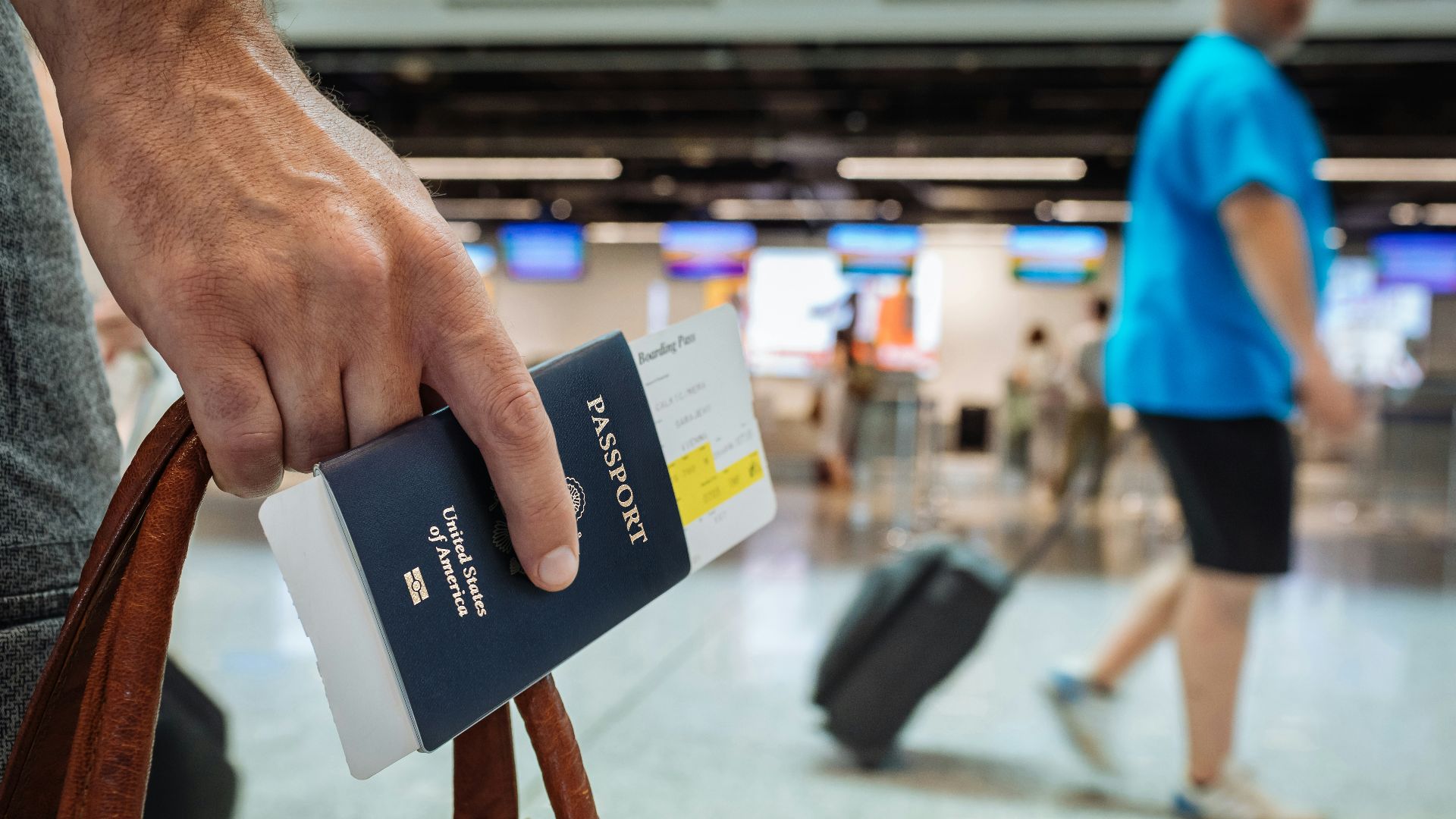 a hand holding a book
