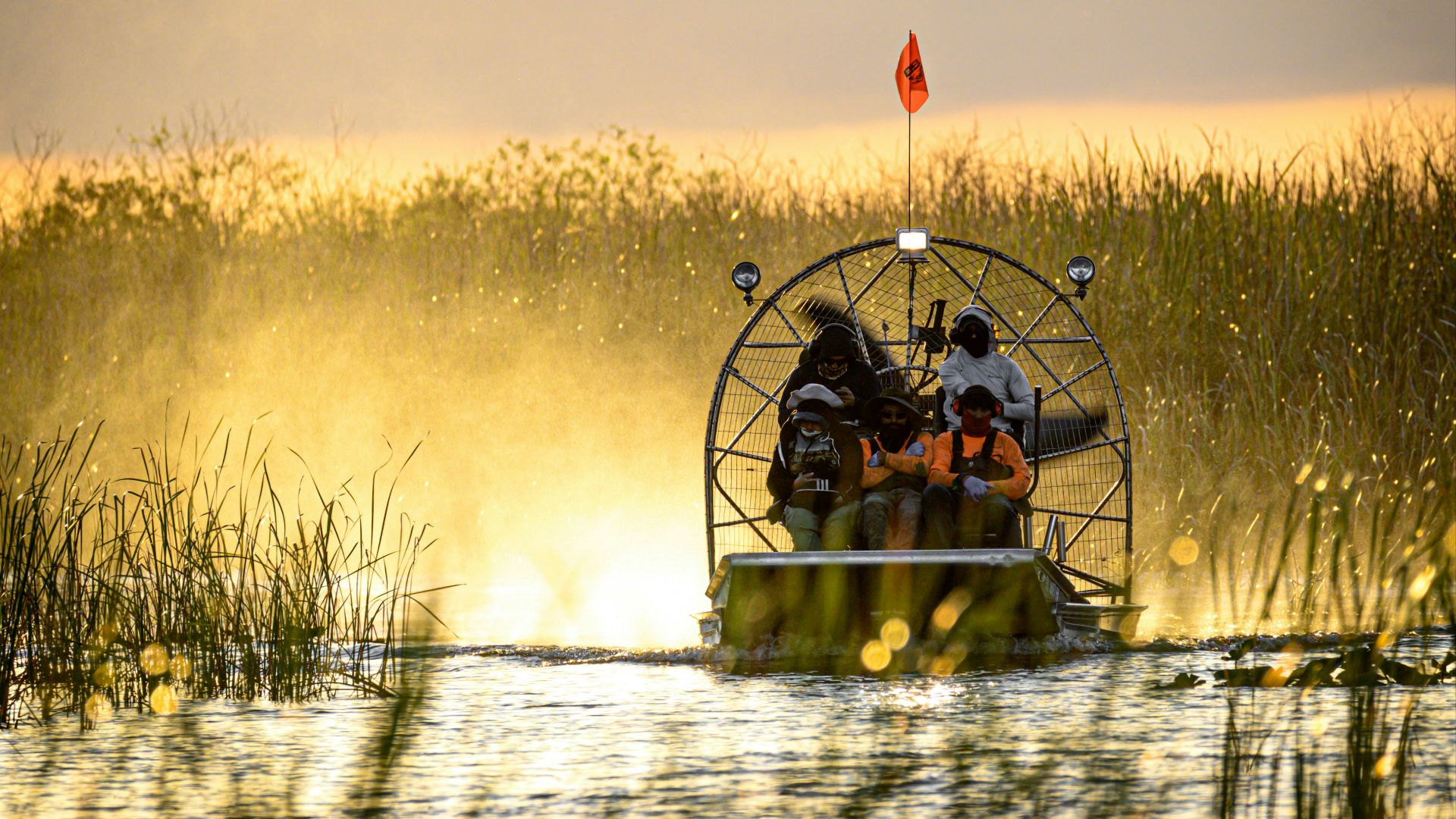 a couple of people on a boat in a body of water
