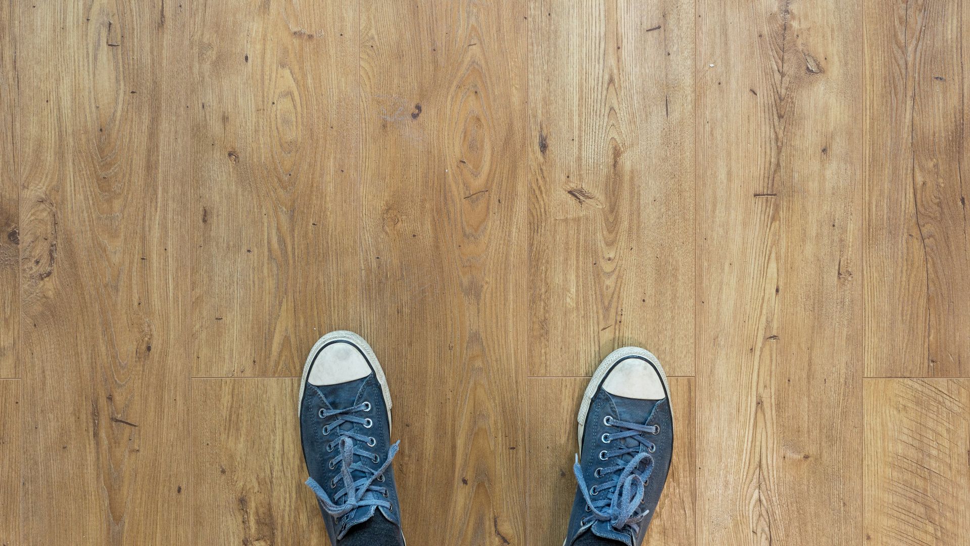 person wearing blue-and-white low-top sneakers