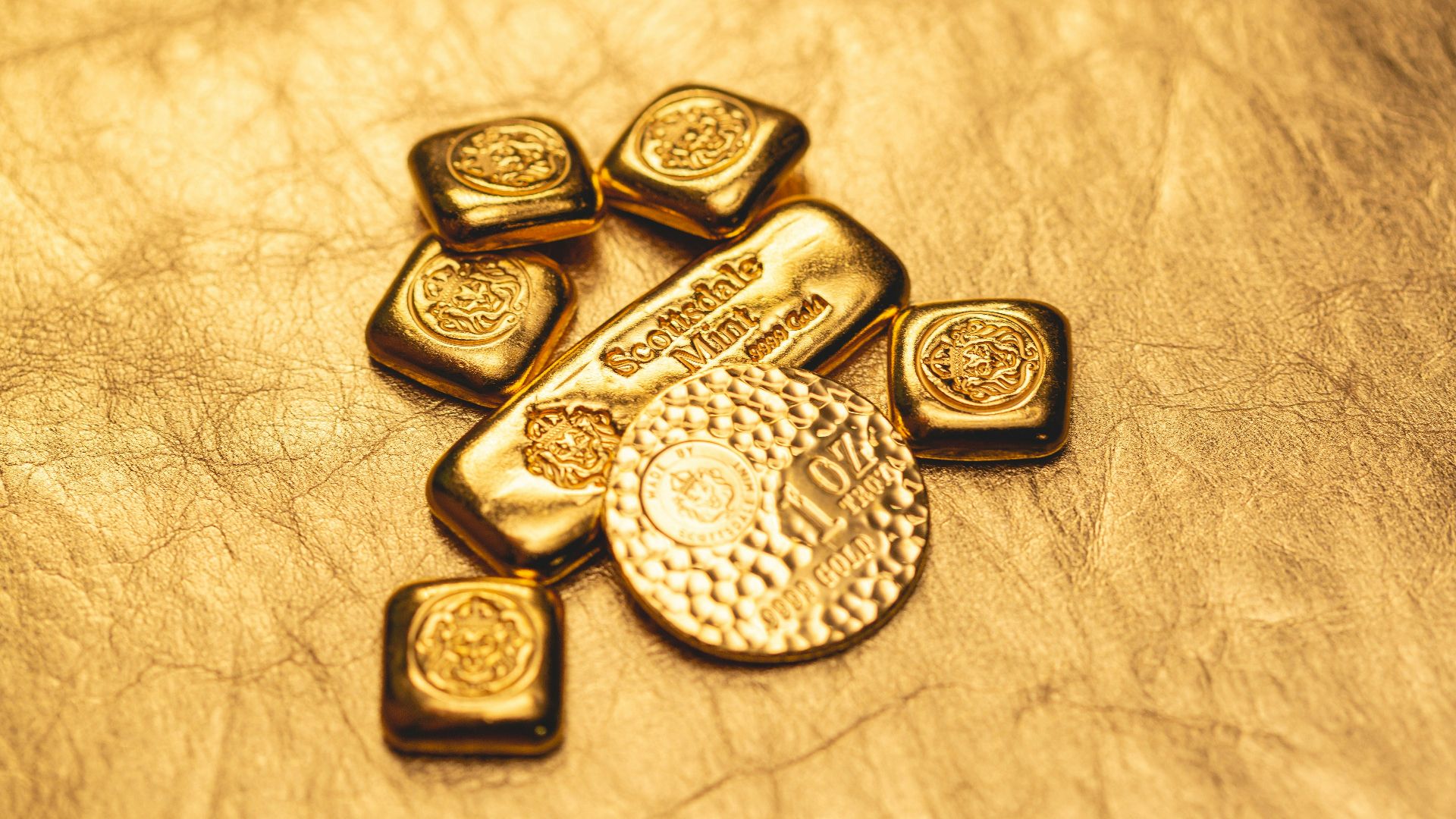 a bunch of gold bars sitting on top of a table