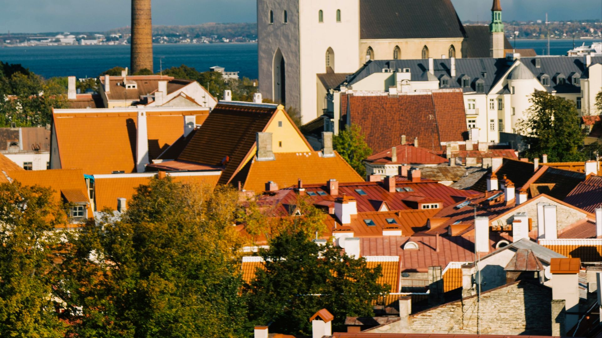 a view of a city with a steeple in the background