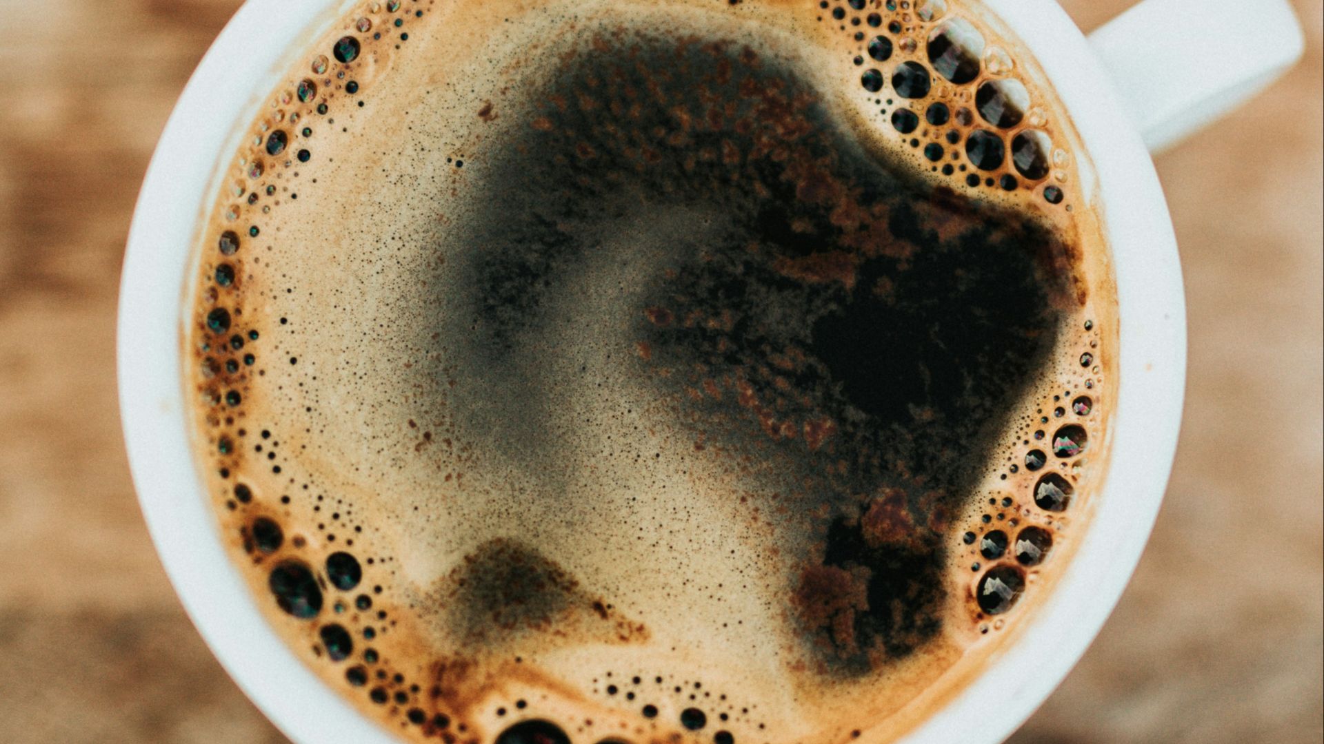 white ceramic mug filled with coffee