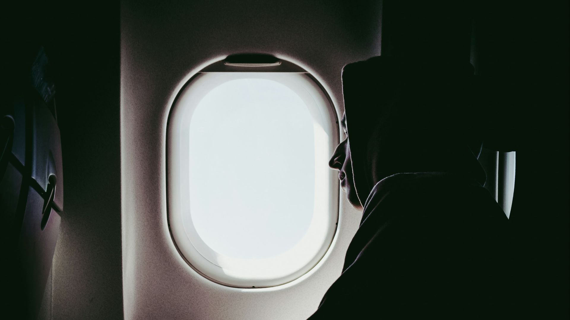 man looking at window