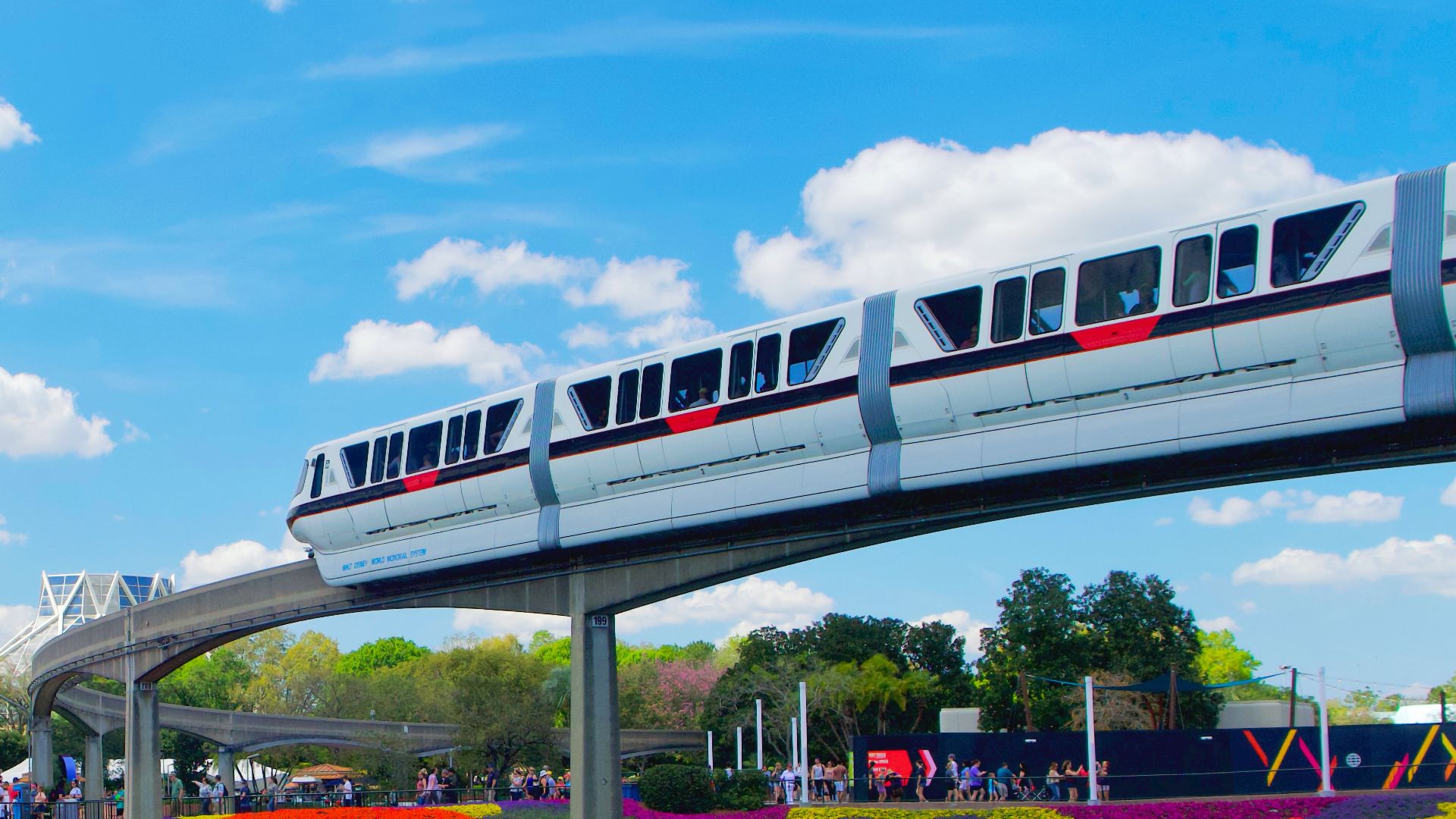 white and blue boat on river under blue sky during daytime