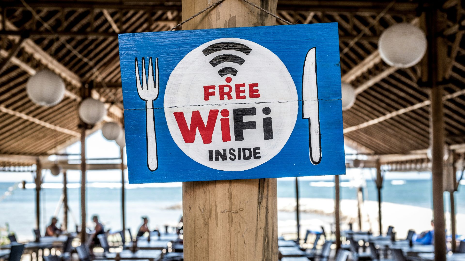 Free WiFi signage on wooden post