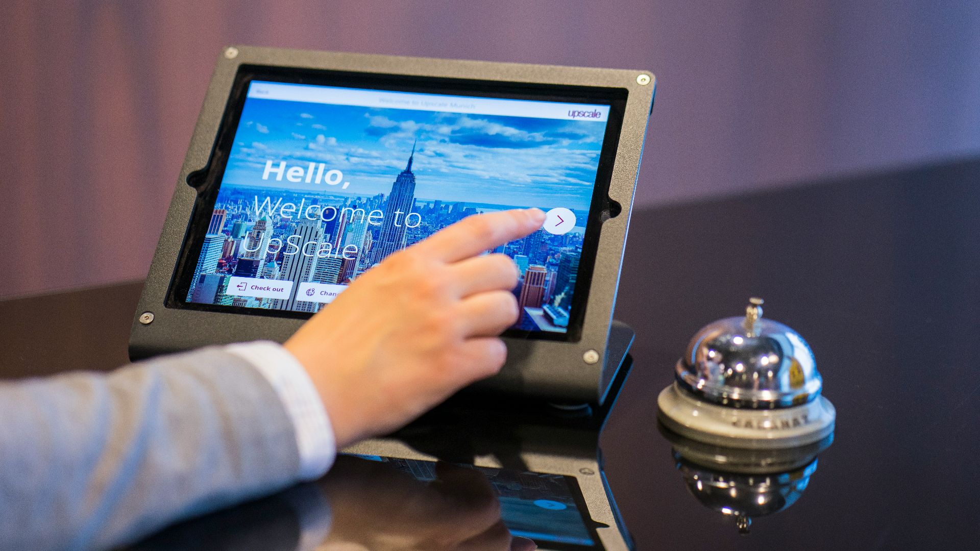 person about to touch black Android tablet computer