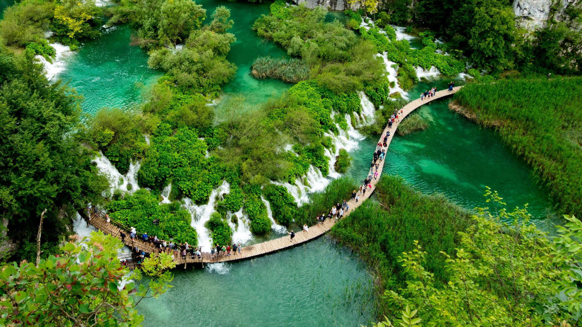 aerial view of river between rocky mountains during daytime