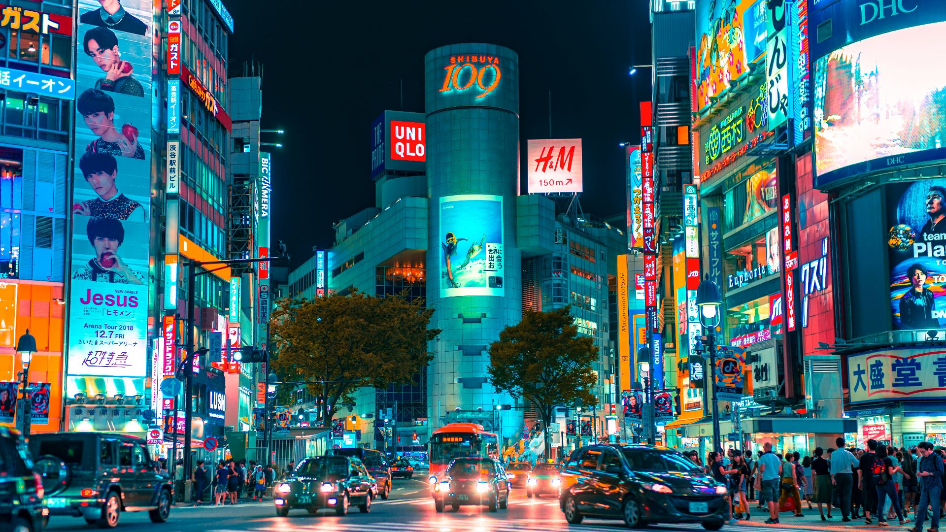people gathered outside buildings and vehicles