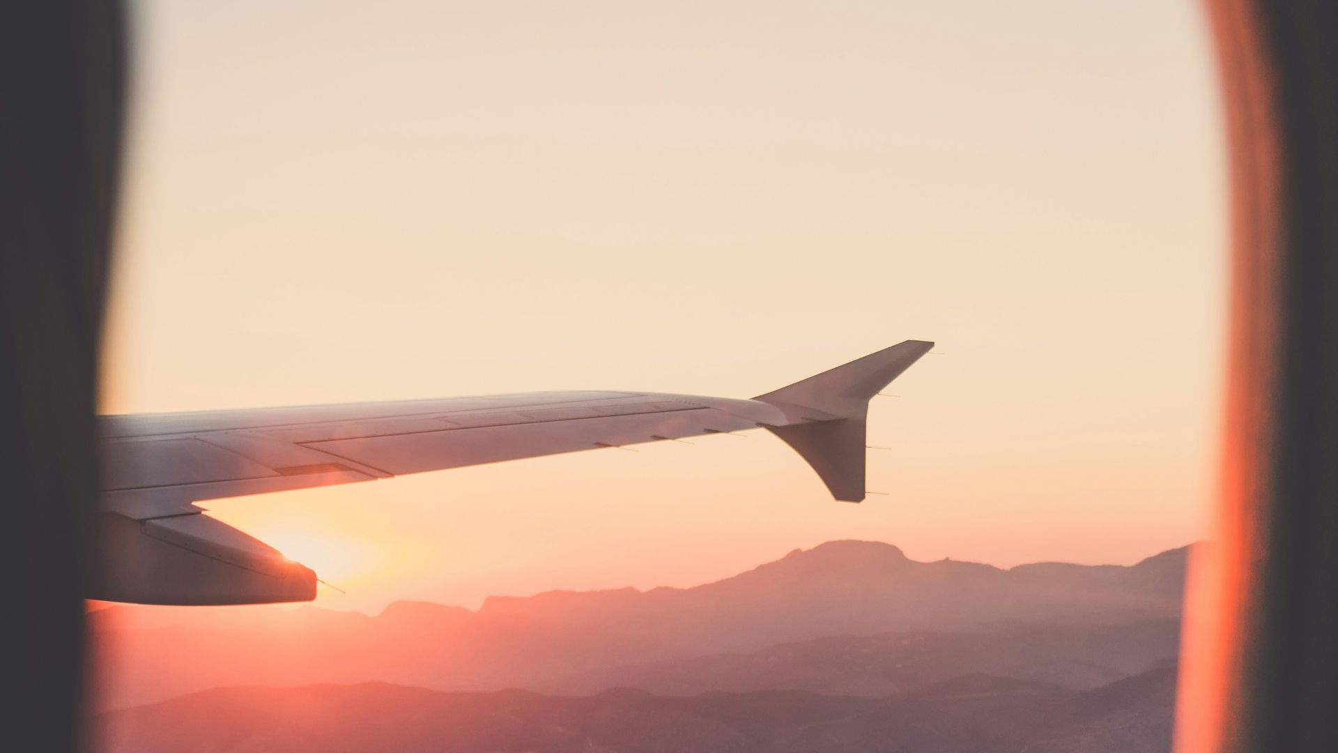 person riding airplane photography