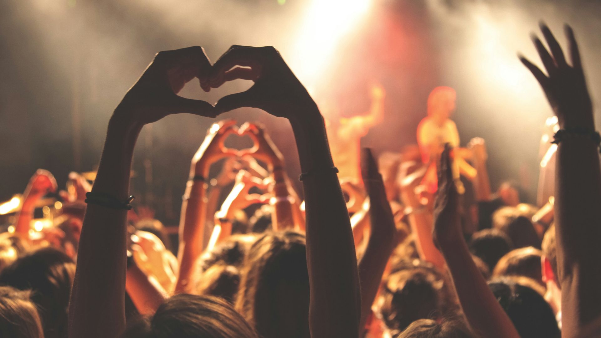 person performing heart hand gesture