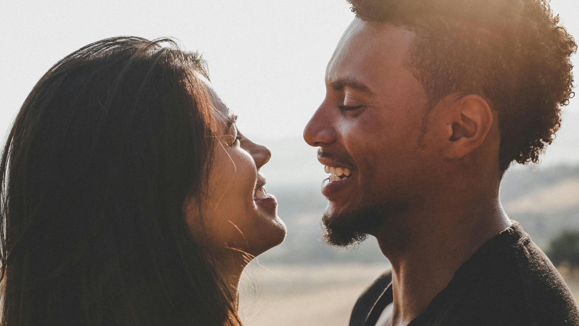 man and woman facing