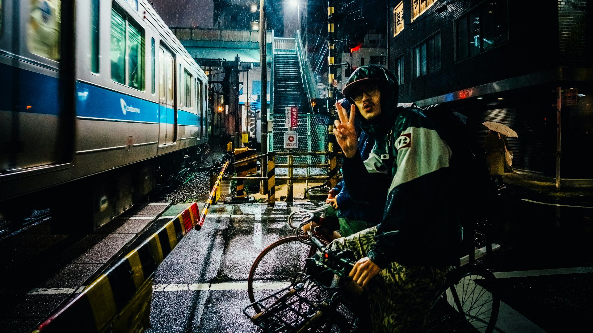 man riding bike near gray running train
