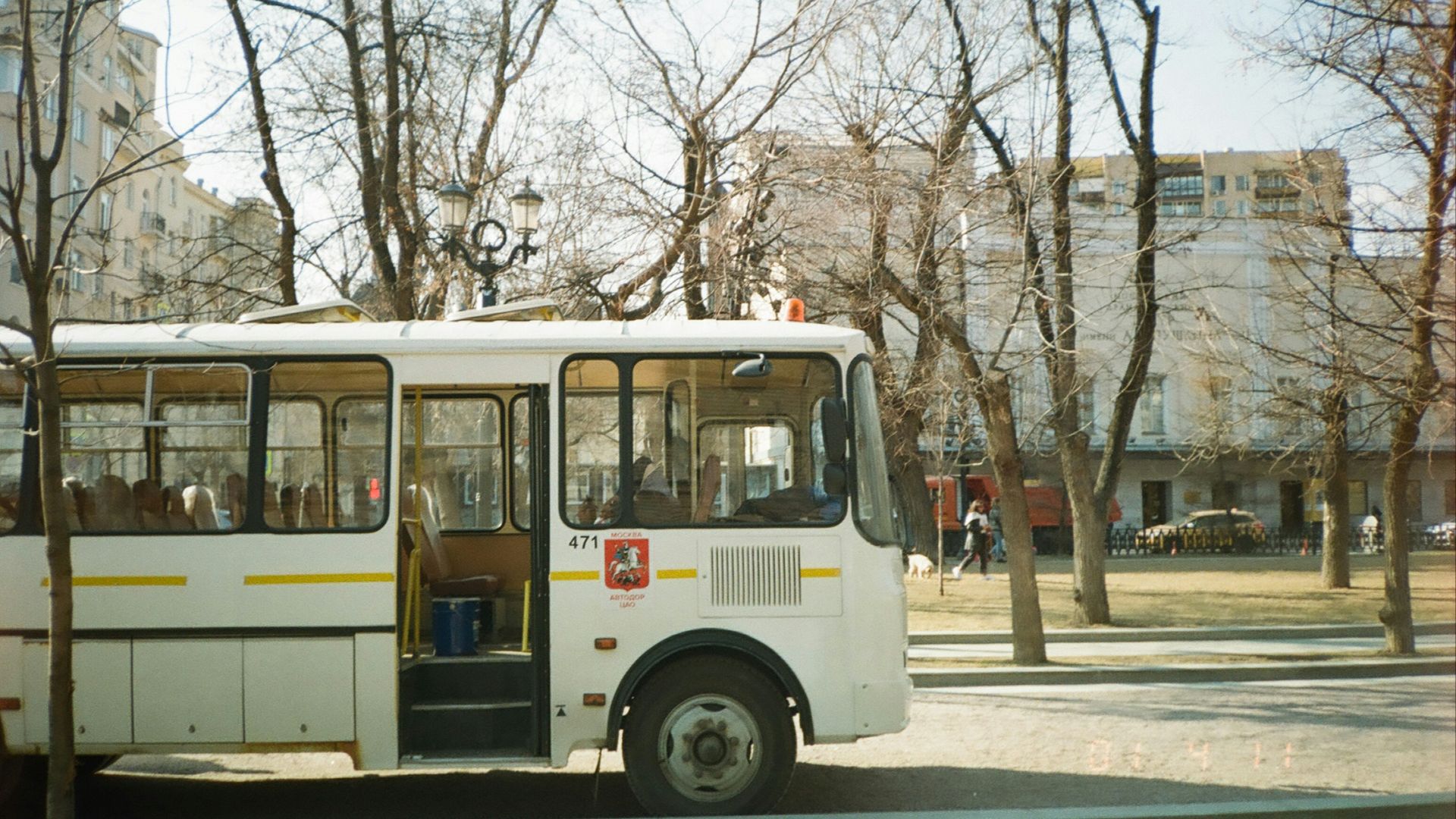 white and red bus on road during daytime
