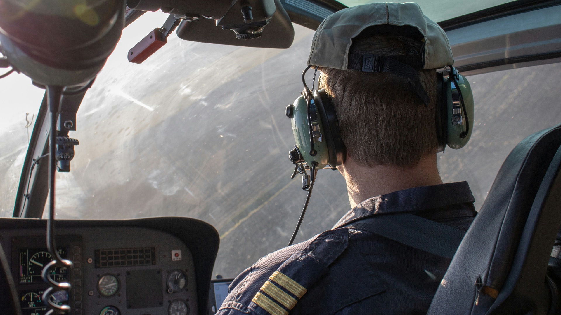 man driving helicopter