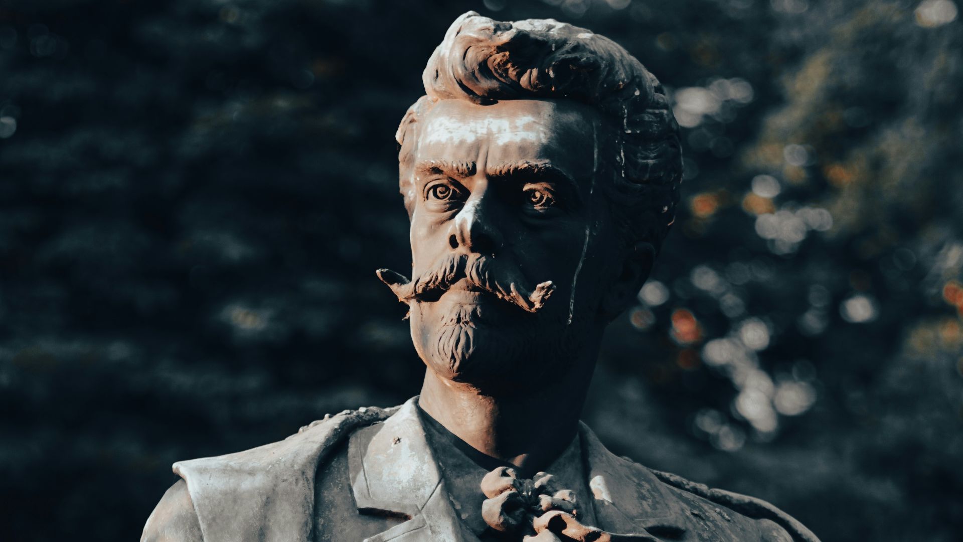 man in black suit statue