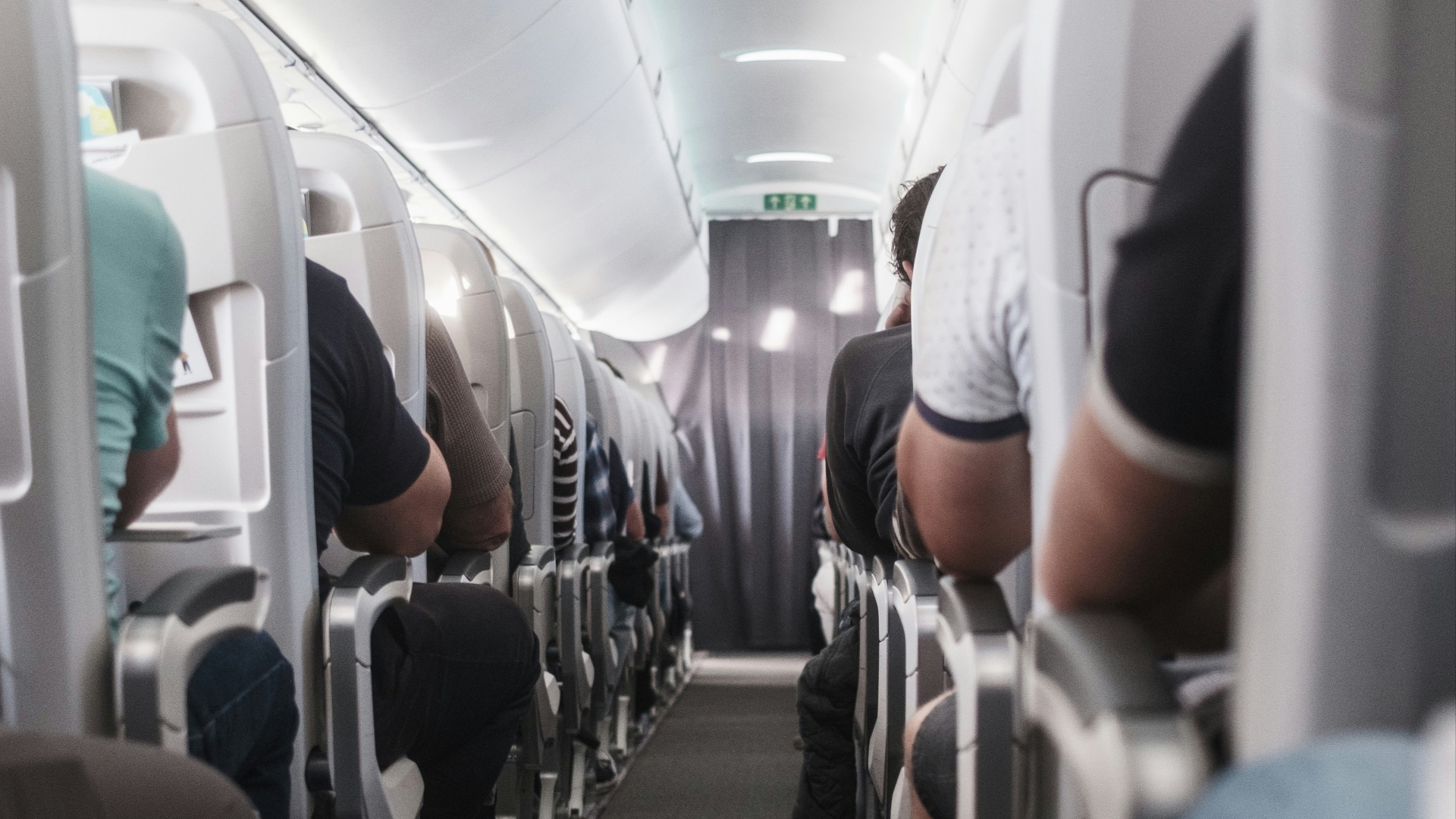 View down the aisle of a commercial airplane