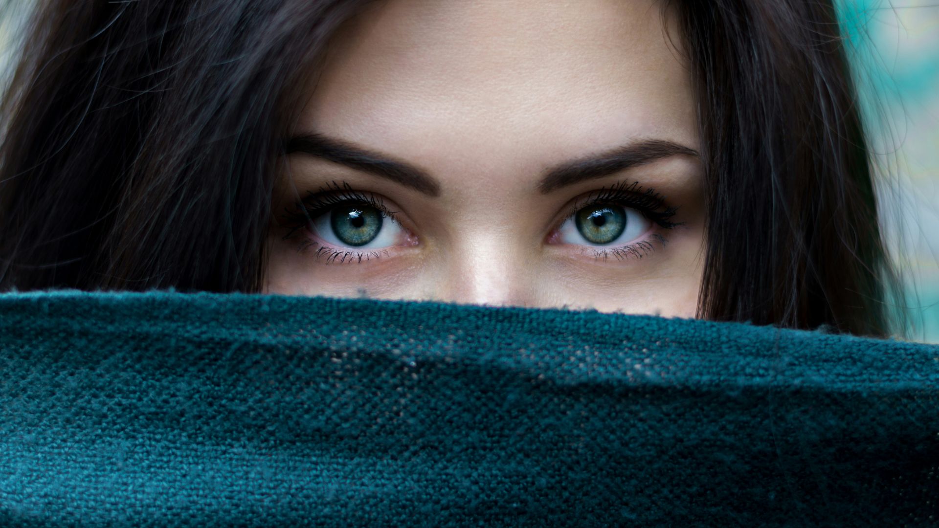 a close up of a person with blue eyes