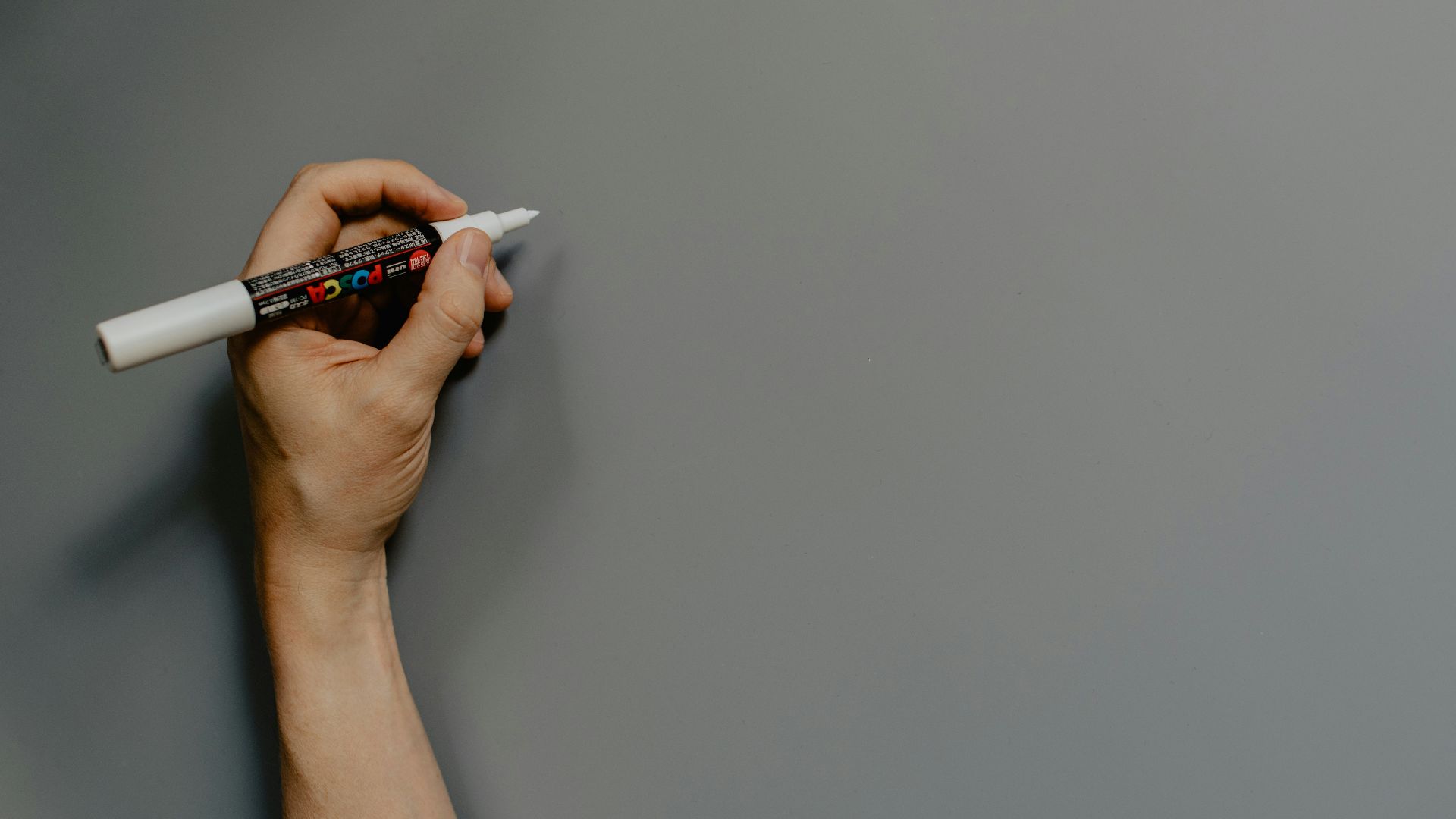 person holding black and white pen