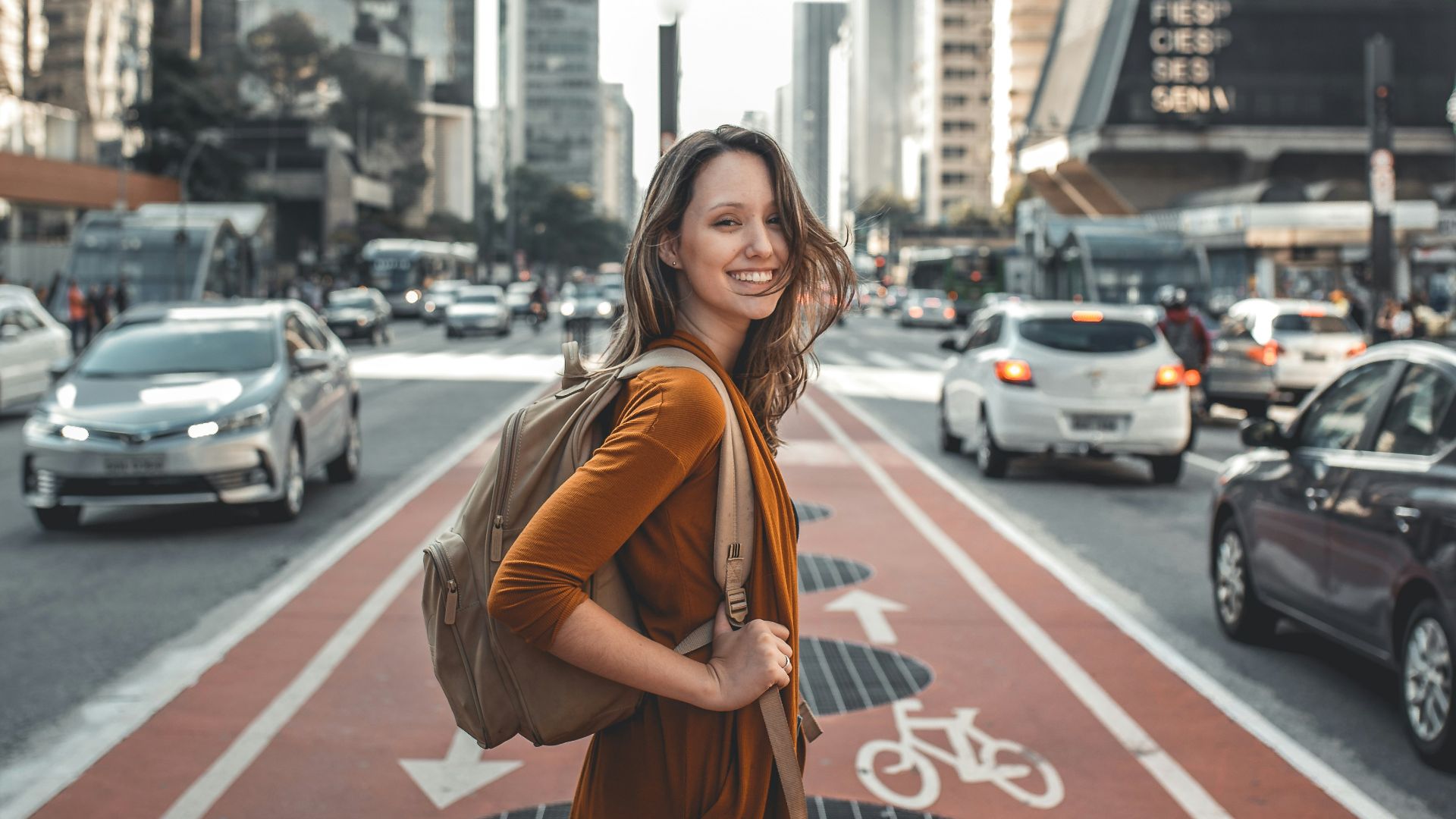 woman standing on middle of road