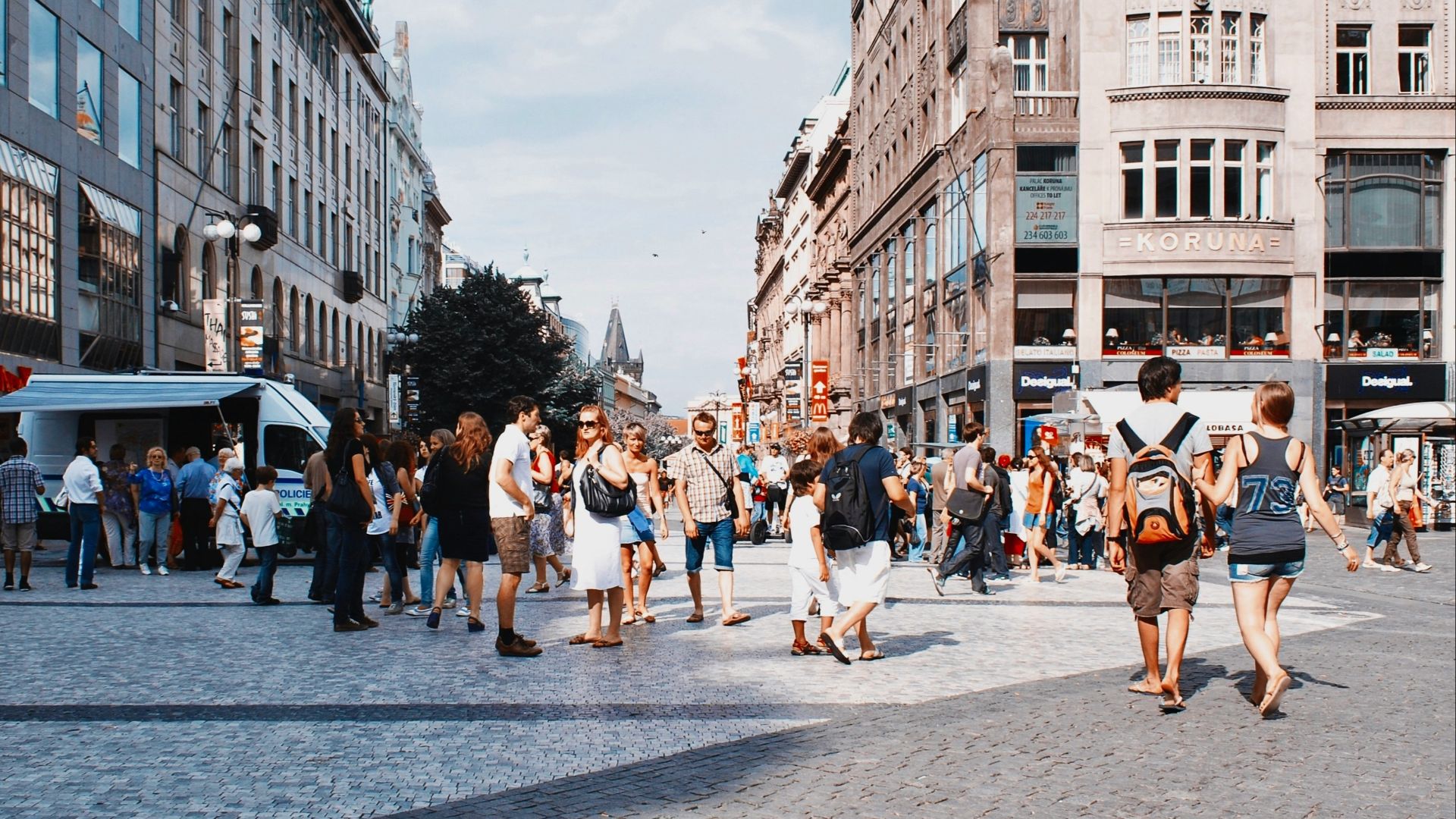a group of people walking in a city