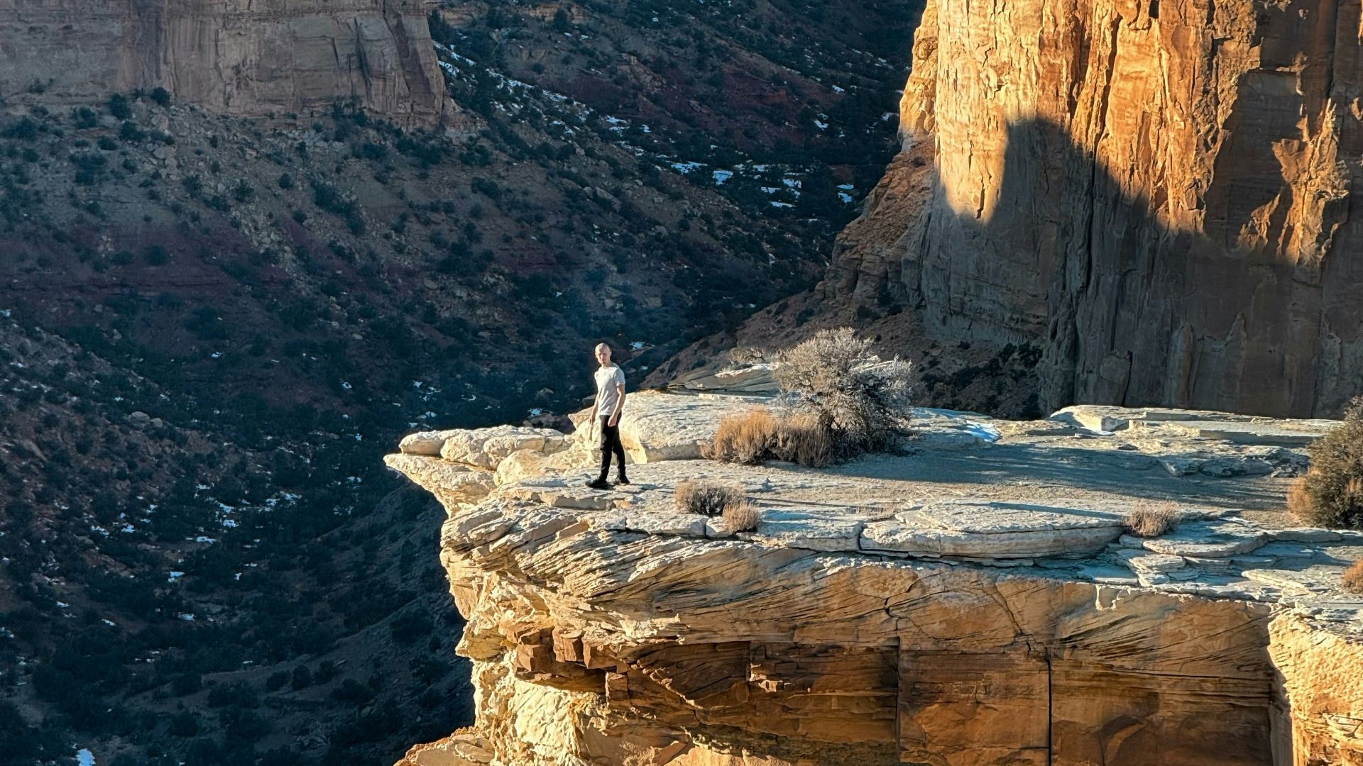 a person standing on top of a cliff