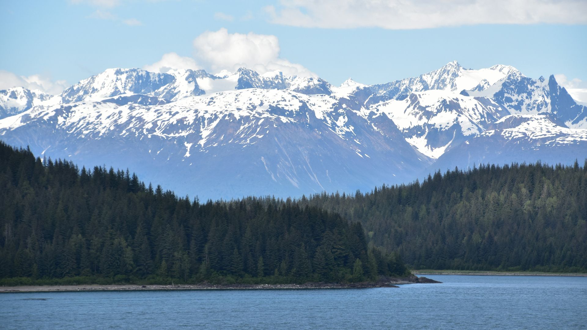 A large body of water with mountains in the background