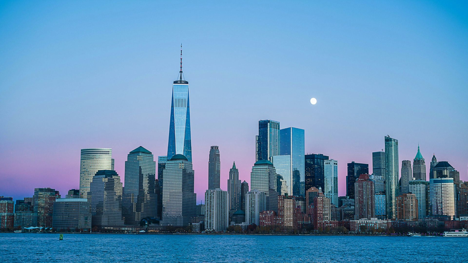 building beside body of water during night time