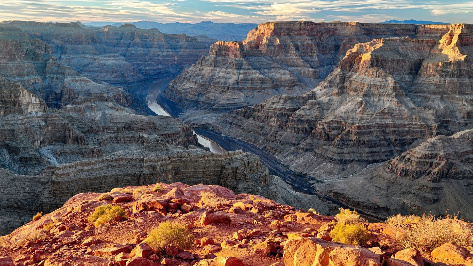 brown rocky mountain under white clouds during daytime