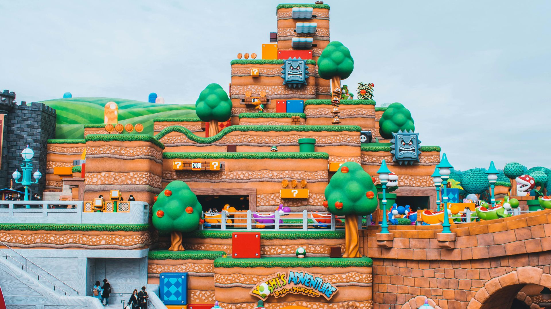 people walking near brown concrete building during daytime